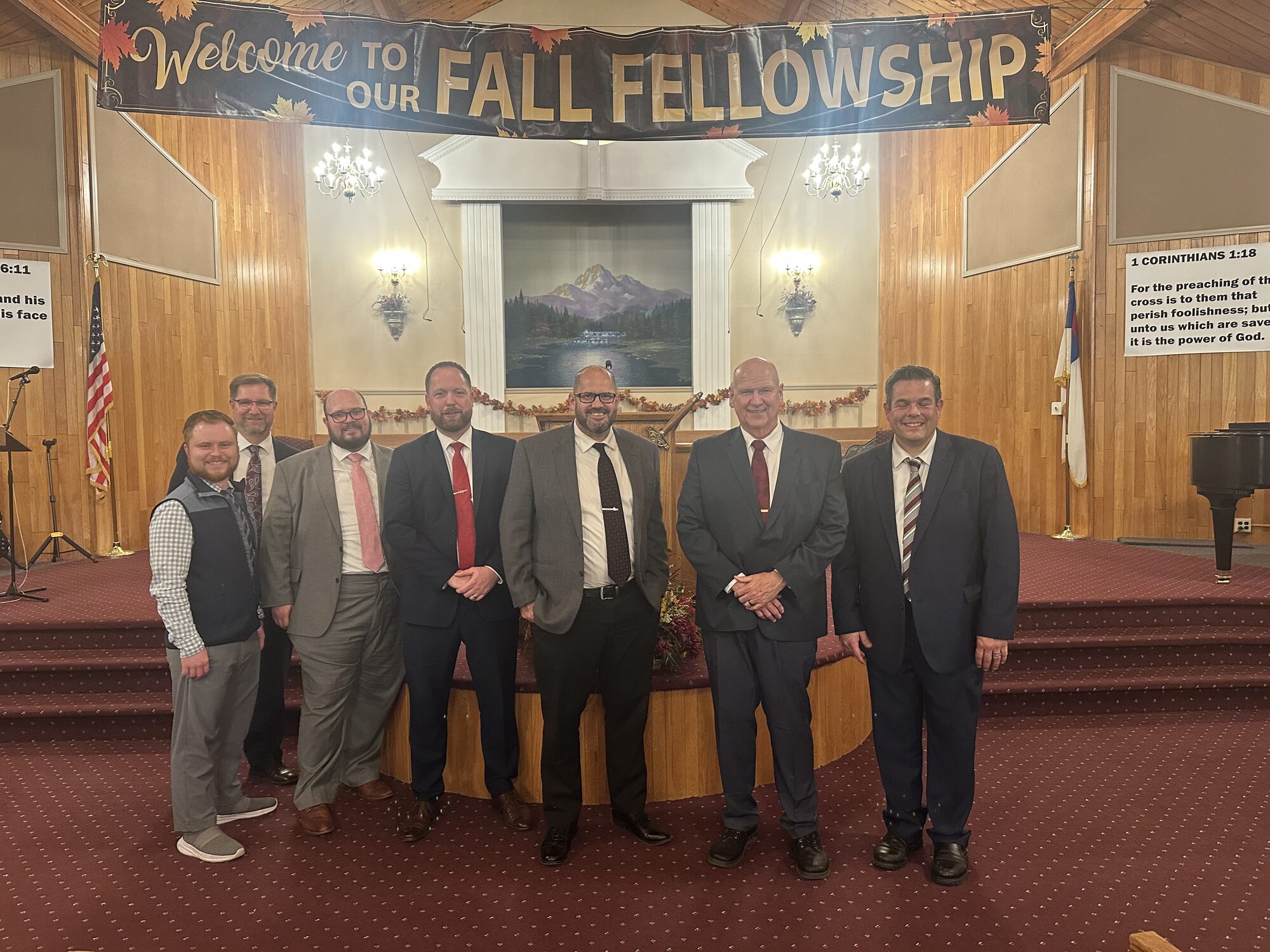 Preachers gathered on the platform beneath the Fall Fellowship banner at Prayer Baptist Church